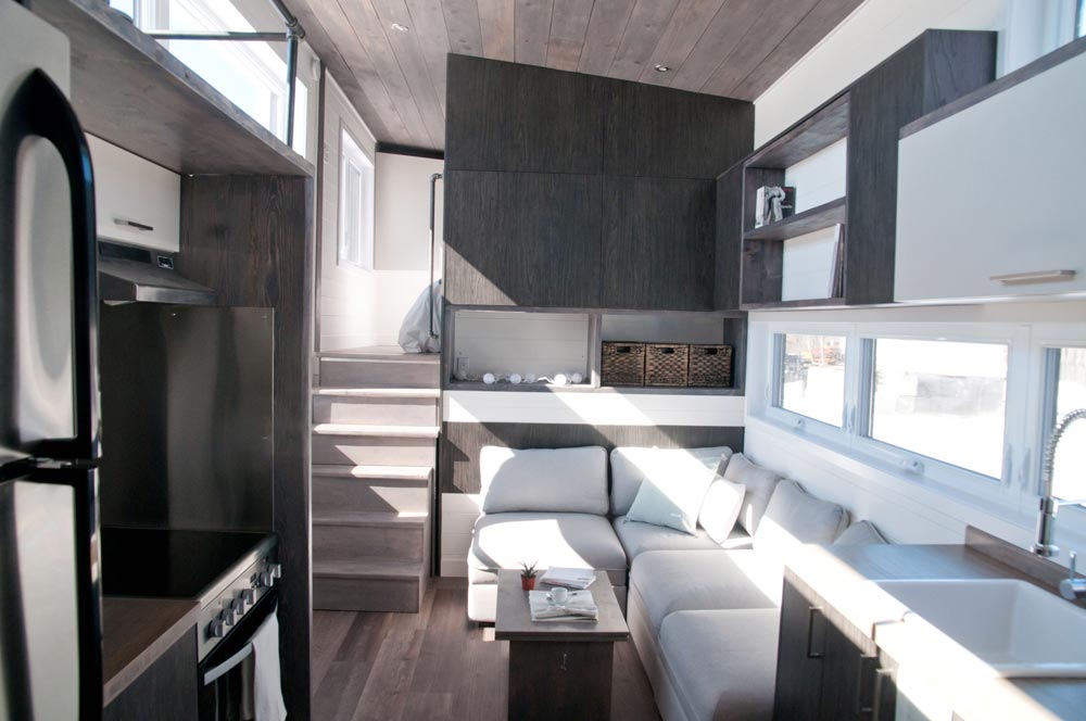 From Quebec, Canada-based Minimaliste is this beautiful 32′ gooseneck tiny house, the Sakura. The 10.5′ wide house totals 380-square-feet including the main floor and loft space.