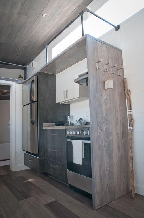 From Quebec, Canada-based Minimaliste is this beautiful 32′ gooseneck tiny house, the Sakura. The 10.5′ wide house totals 380-square-feet including the main floor and loft space.